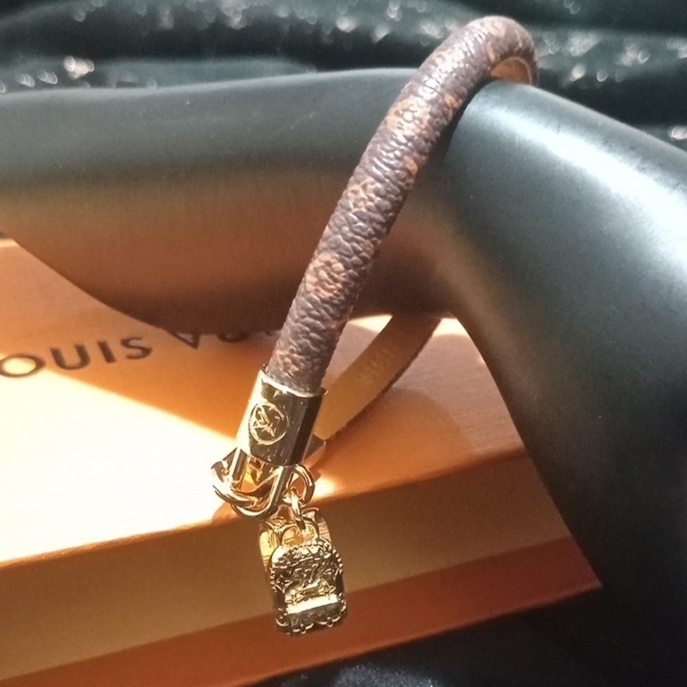 Louis Vuitton Gold and Brown Bracelet with Elegant Charms